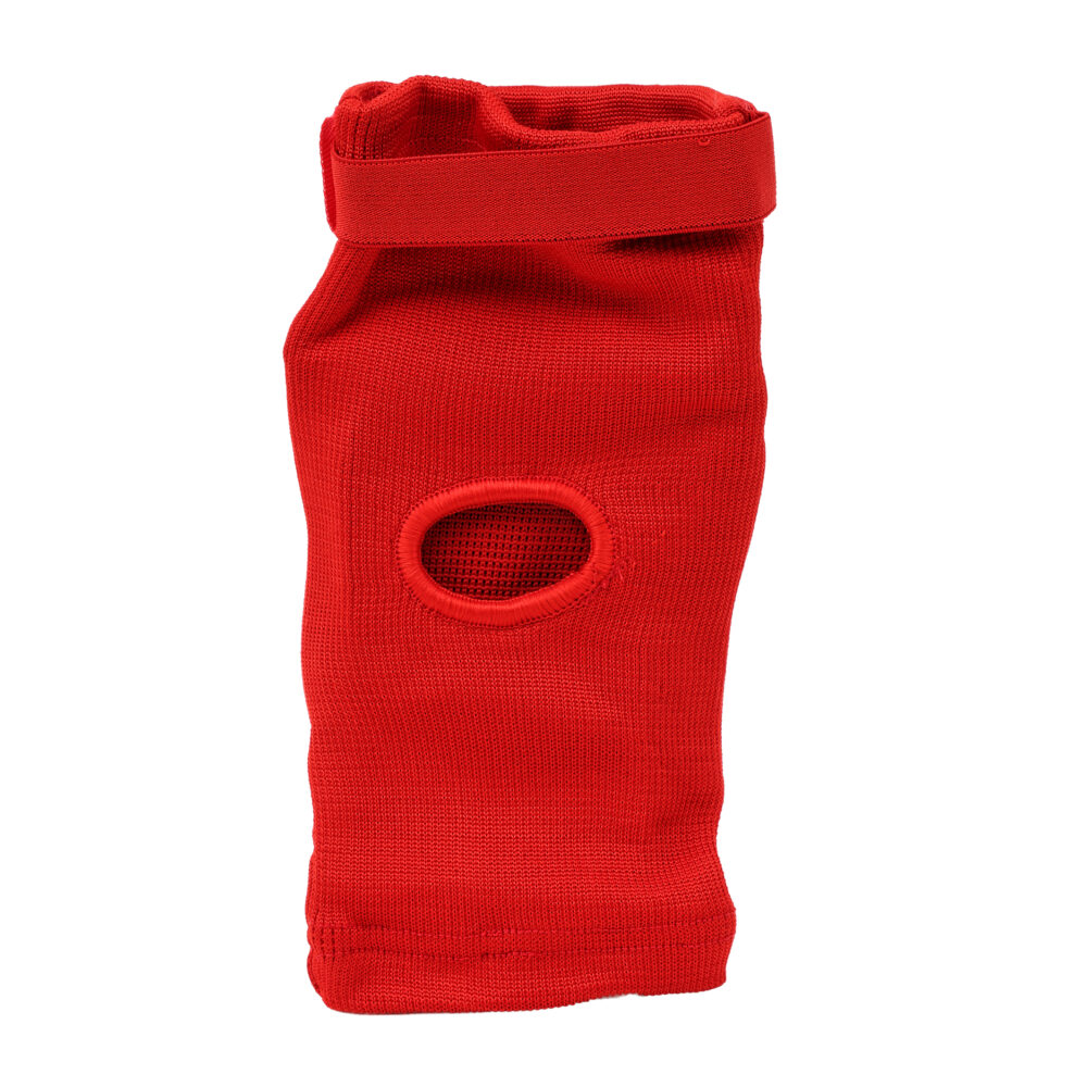 Protège-coude rouge Montana ELBOWGUARD déplié, montrant le manchon en textile extensible qui maintient la protection en place sans serrer.
