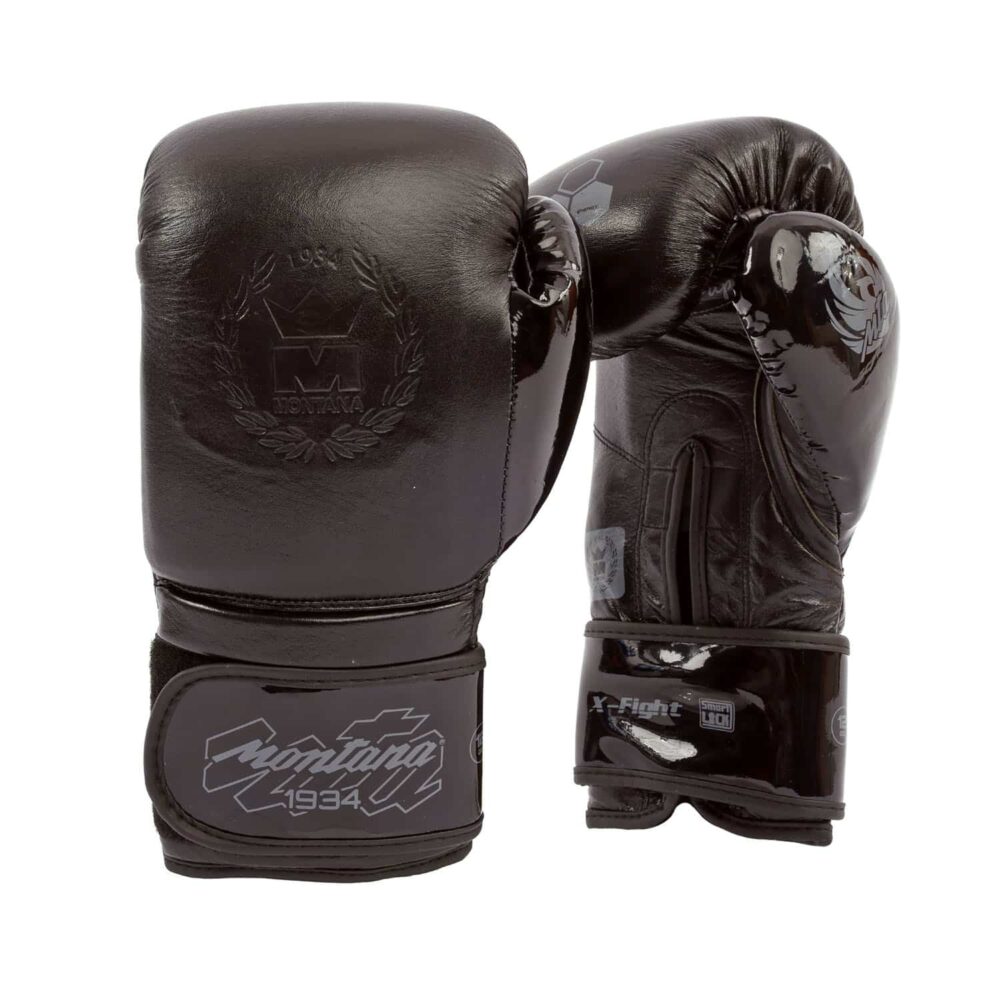 Gants de boxe noirs Montana X-FIGHT Evo BlackCode conçus pour les disciplines multiboxes comme la boxe anglaise, la boxe thaï, le kick boxing et le full contact, avec mousse SHOCK ABSORBING 4 couches et maintien poignet haute sécurité.