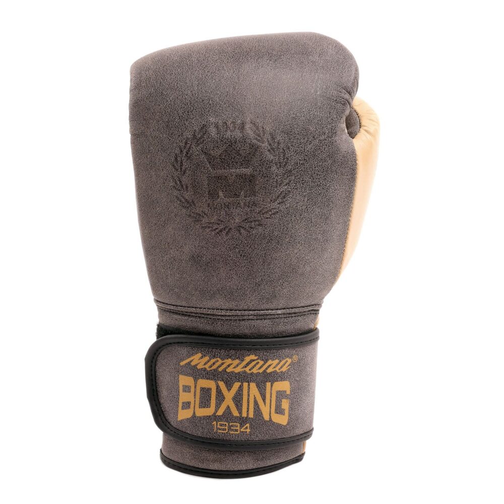 Gants de boxe marron Montana X-FIGHT Heritage adaptés à la pratique de la boxe anglaise, Muay Thai, full contact, boxe thaï et kick boxing, avec finition vintage effet cuir vieilli et fermeture velcro sécurisée.