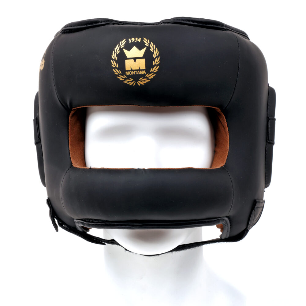 Casque de boxe noir Montana FACE PROTECTOR NewCode vu de face, montrant la barre de protection du nez, la doublure cuir marron et le blason doré 1934.